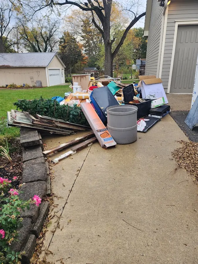 Dumpster being loaded with debris for 10 Yard Dumpster Rental in Orangevale